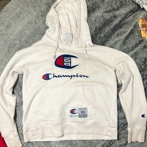 A white graphic champion hoodie.